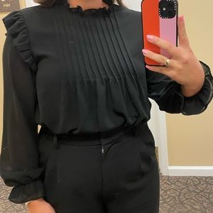 Black blouse with ruffle details